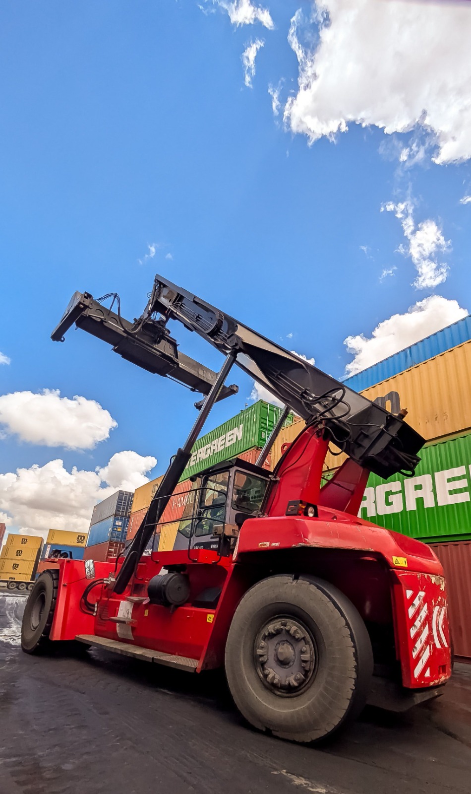 Semi-electric stacker available to buy in RAK, showing reinforced forks used for warehouse and retail stock handling.
