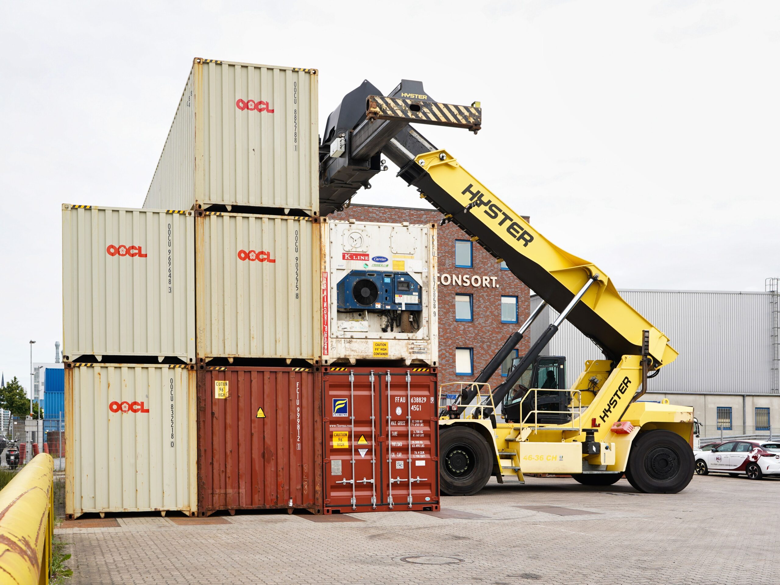 Used stacker forklift parked at an industrial site, showing stackers sale options for Abu Dhabi businesses