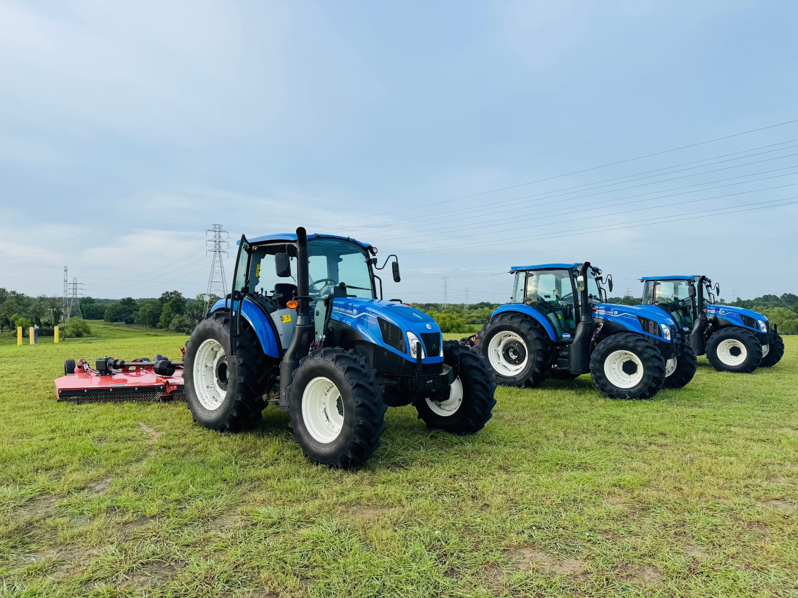 New agricultural tractor in Dubai available for sale at ZoomLift's equipment yard under clear desert skies.