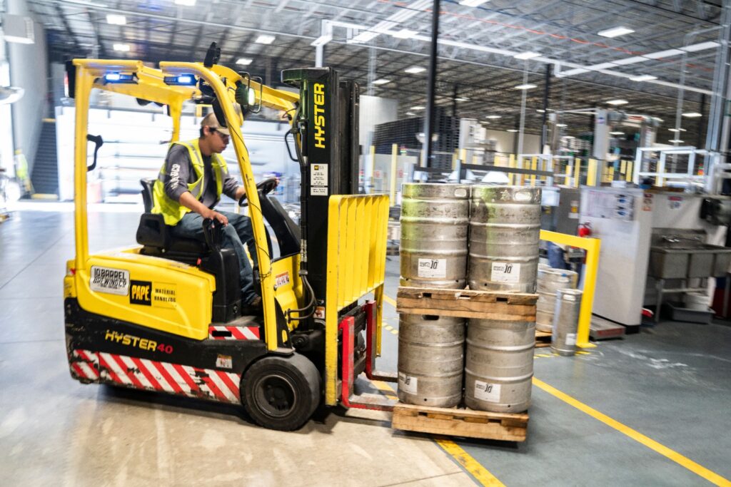 Electric forklift Ajman model operating quietly in an indoor cold storage facility for local businesses