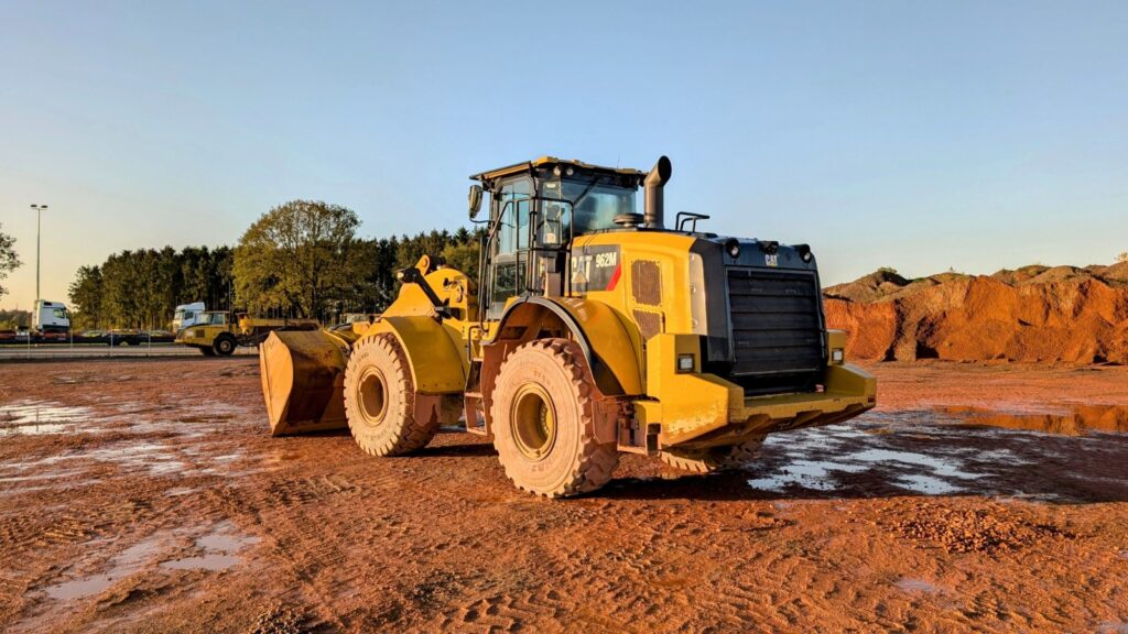 Wheel loaders in Dubai lined up at Zoomlift's yard, ready for sale to construction and quarry operators.