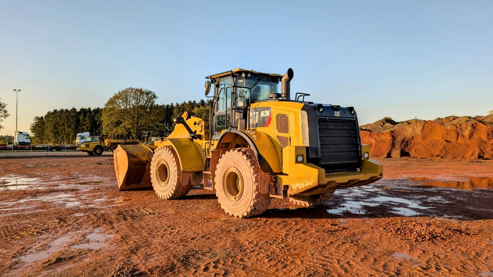 Wheel loaders in Dubai lined up at Zoomlift's yard, ready for sale to construction and quarry operators.