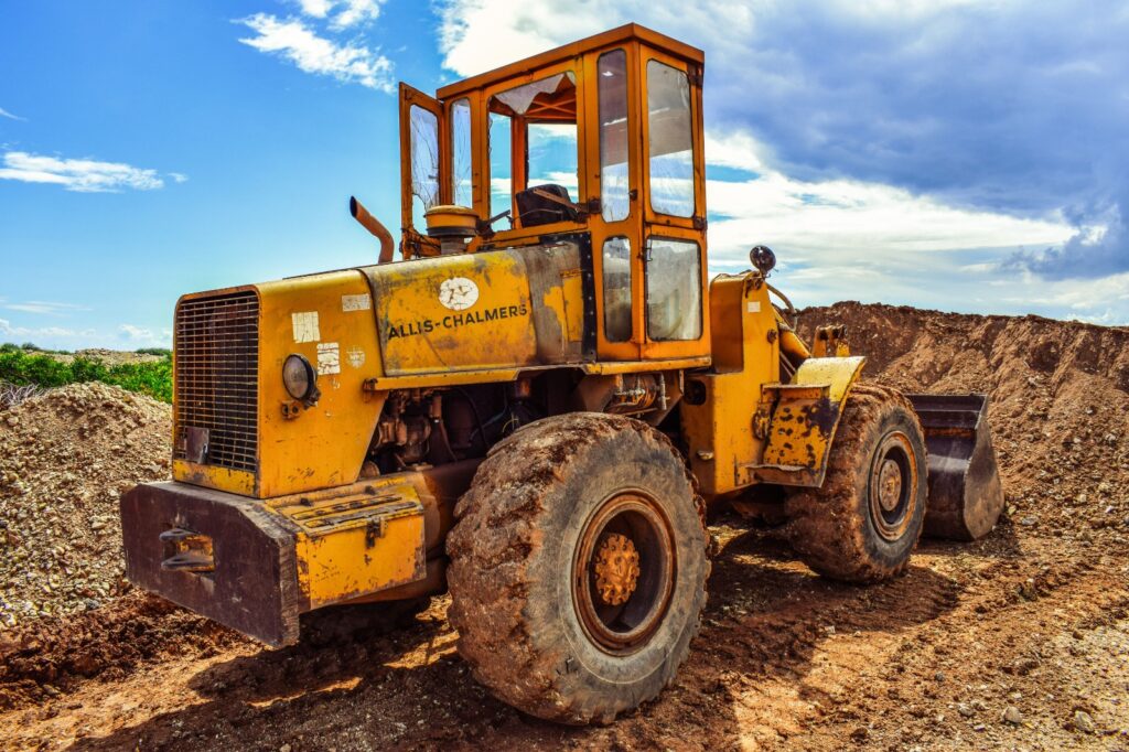 Technician inspecting a used wheel loader in Dubai before delivery to a Zoomlift customer