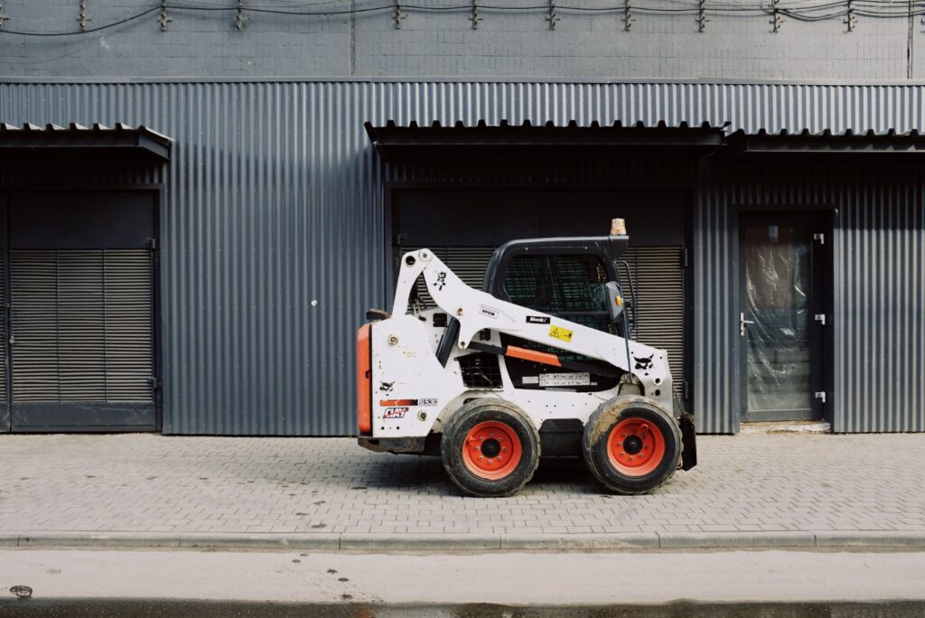 Wheel loaders in Ajman working on a construction site, showing ZoomLift equipment in active use.