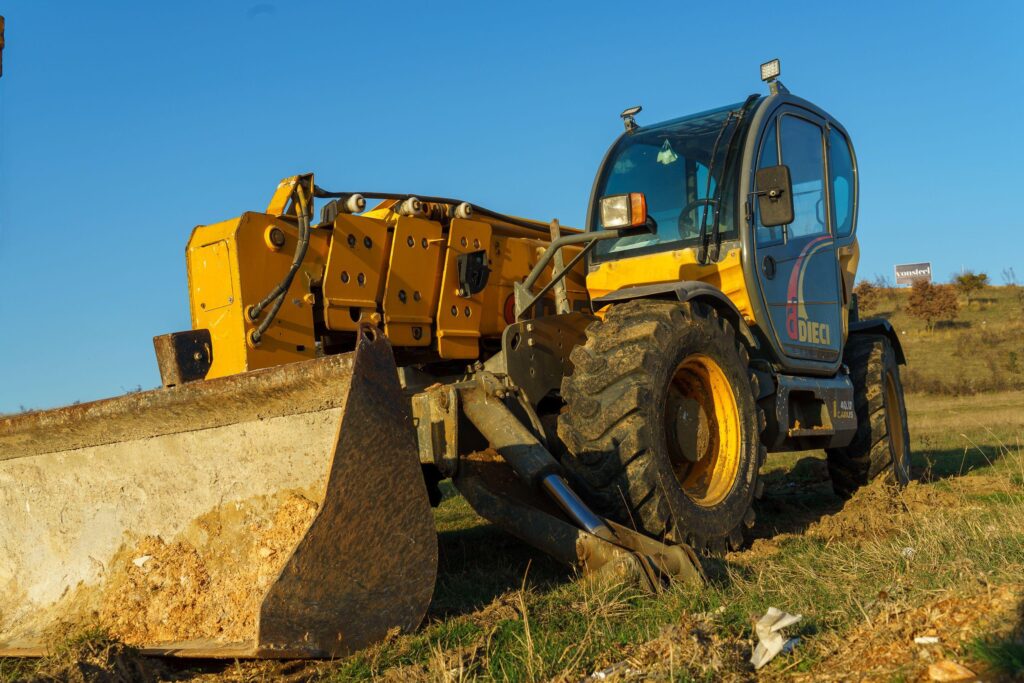 A Zoomlift wheel loader operating on a construction site in Ras Al Khaimah, UAE.